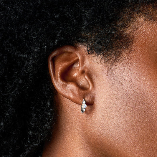 Moonstone hoop earring on the ear