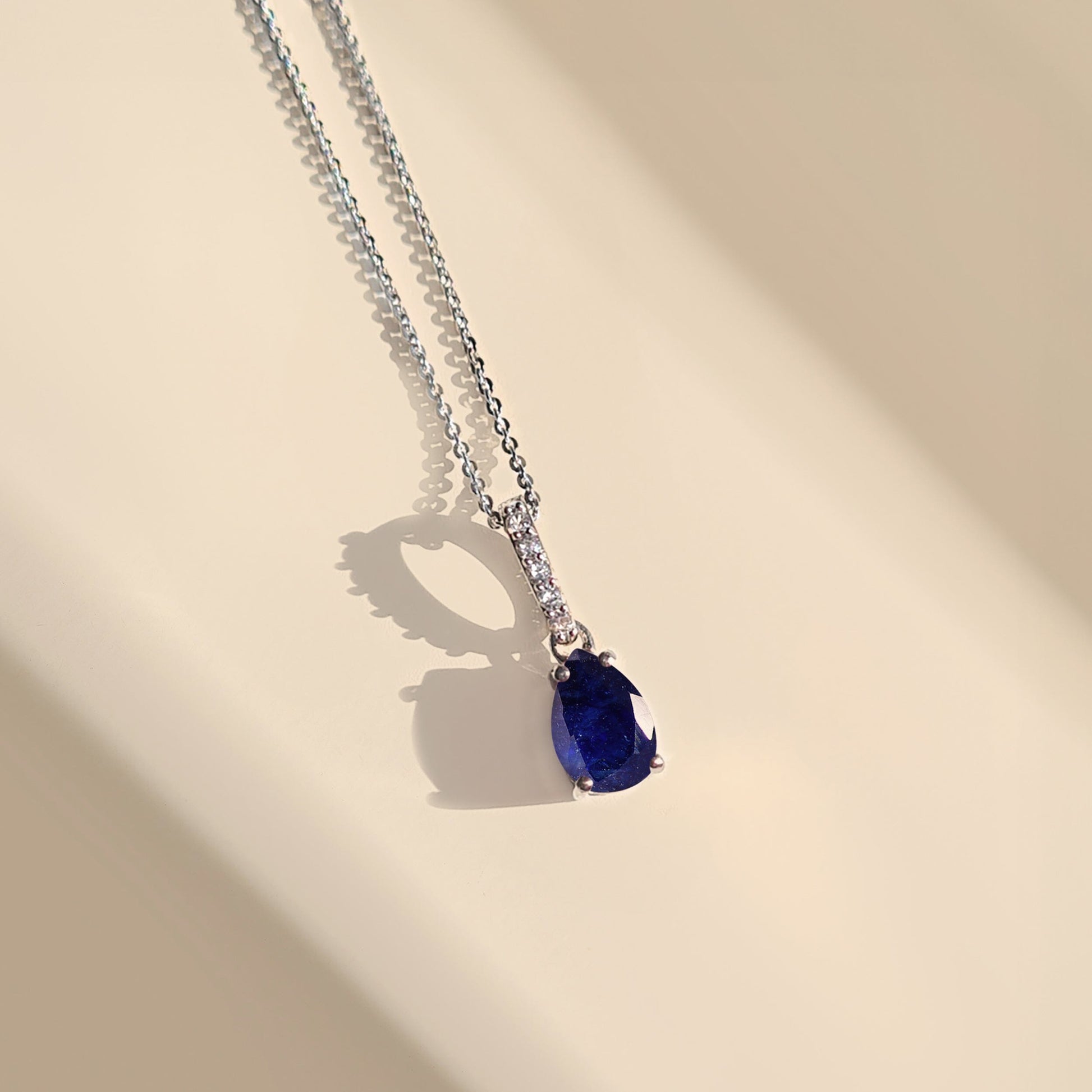 Blue Sapphire Necklace Sway - silver flat lay