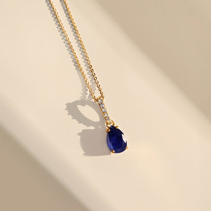 Blue Sapphire Necklace Sway - yellow gold flat lay