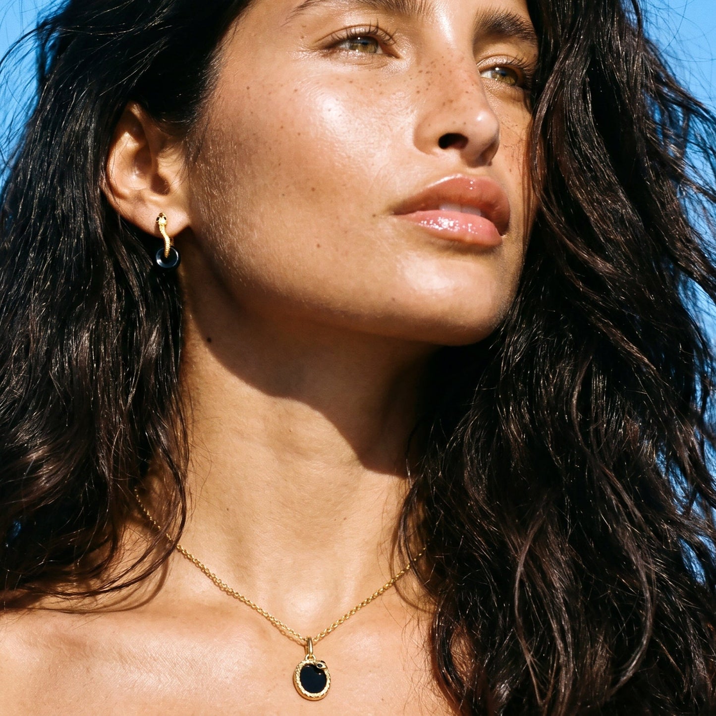 Black Obsidian Earrings - Serpent - worn yellow gold lifestyle