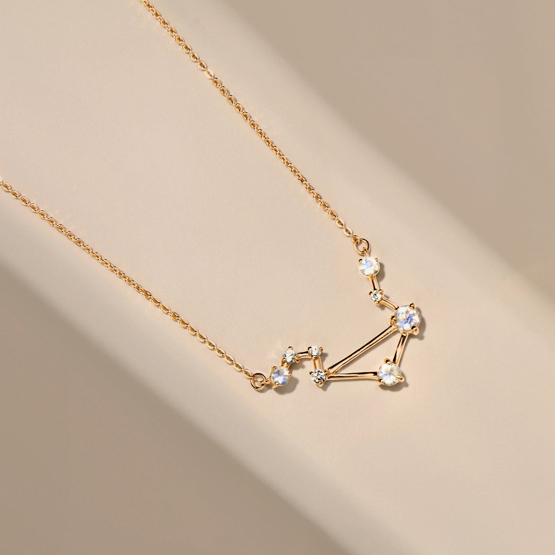 Libra necklace yellow gold flat lay