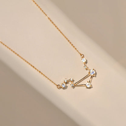 Libra necklace yellow gold flat lay