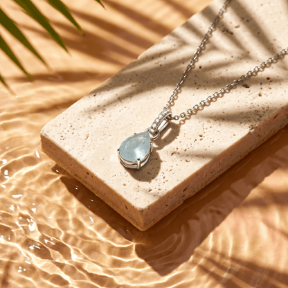 Aquamarine Necklace Sway - March Birthstone - silver flat lay