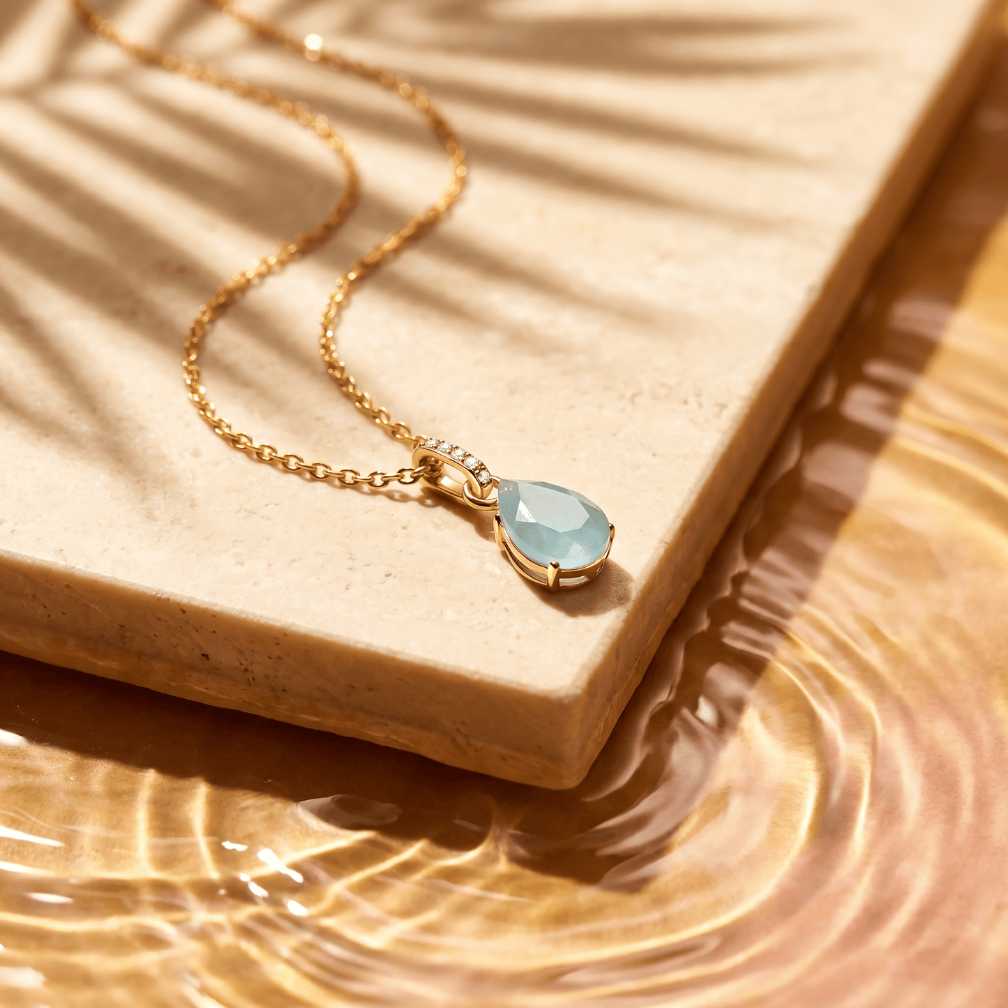 Aquamarine Necklace Sway - March Birthstone - yellow gold flat lay
