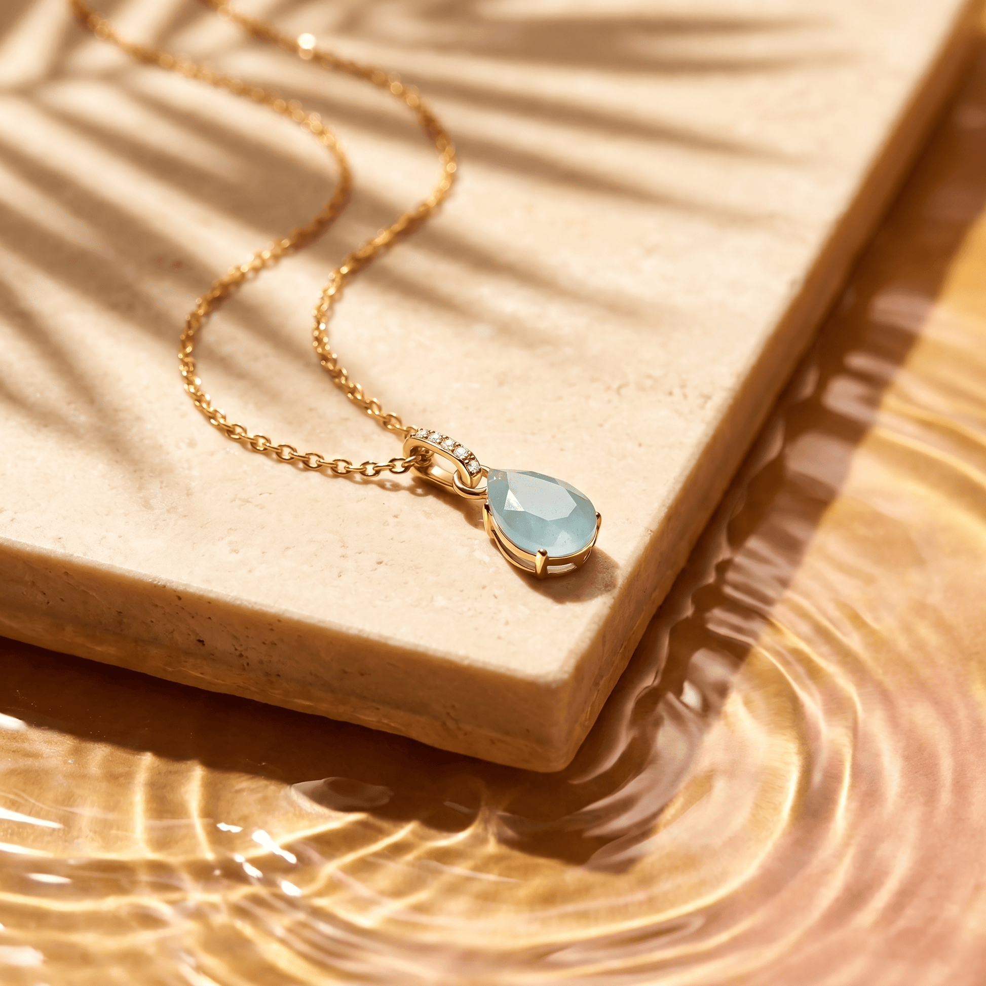 Aquamarine Necklace Sway - March Birthstone - yellow gold flat lay