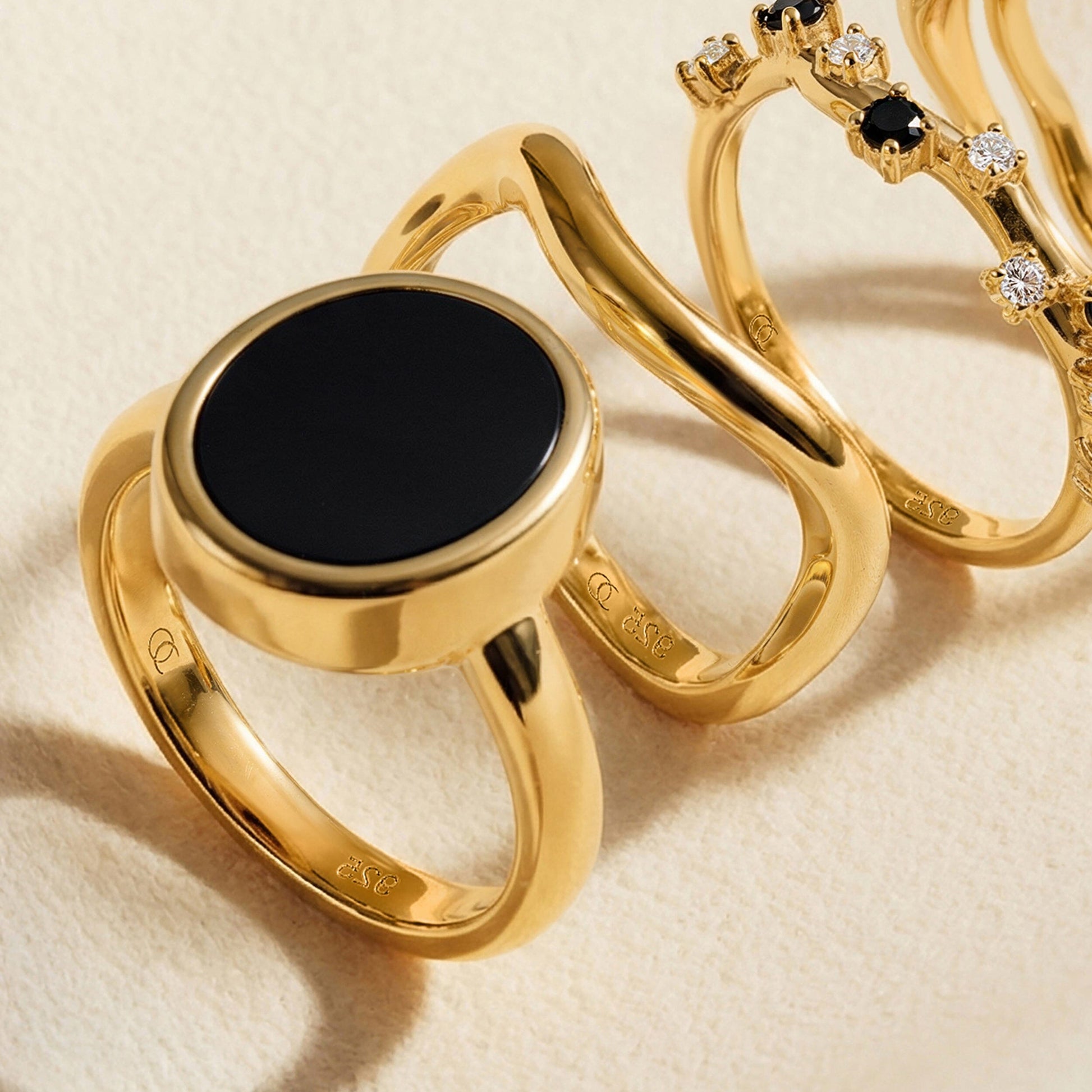 Black Onyx Ring Enfolded yellow gold flatlay