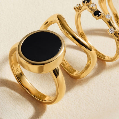 Black Onyx Ring Enfolded yellow gold flatlay