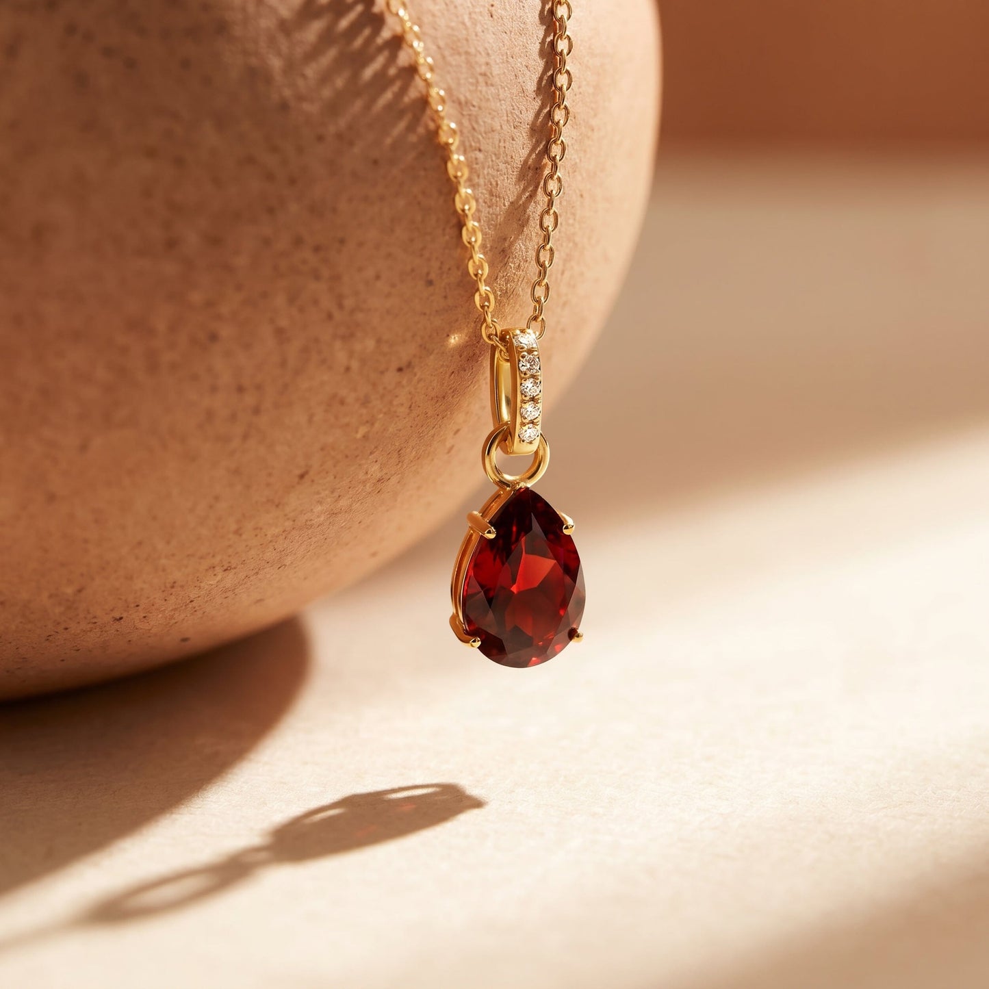 Garnet Necklace Sway - January Birthstone - yellow gold flat lay