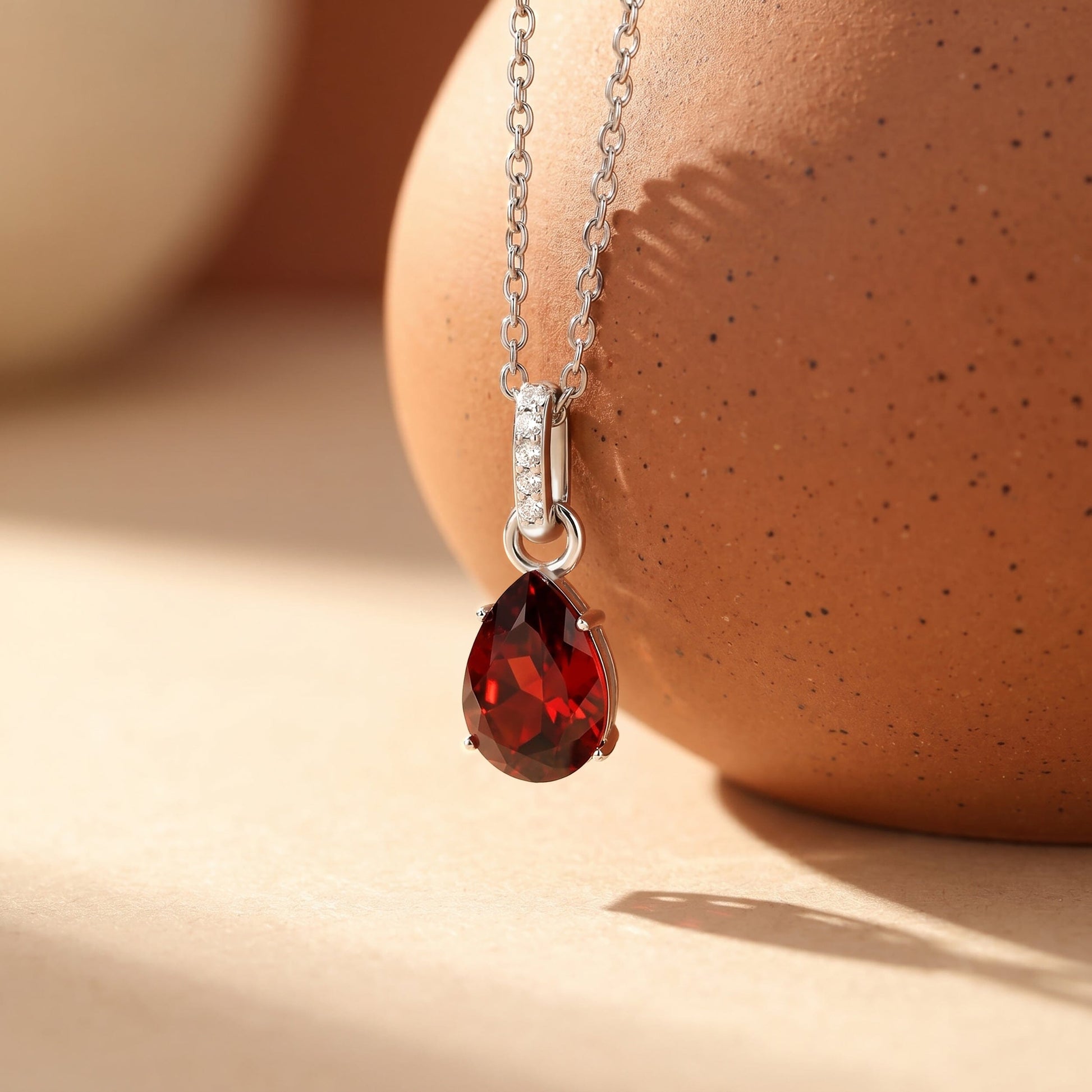 Garnet Necklace Sway - January Birthstone - silver flat lay