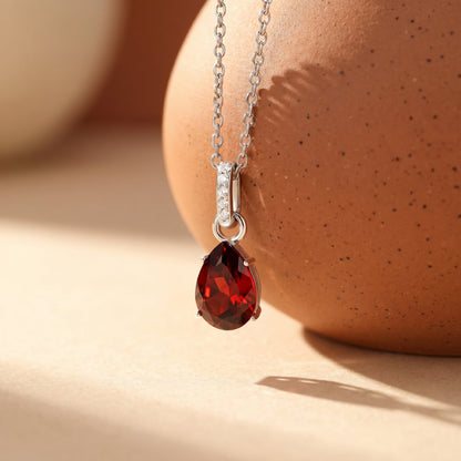 Garnet Necklace Sway - January Birthstone - silver flat lay