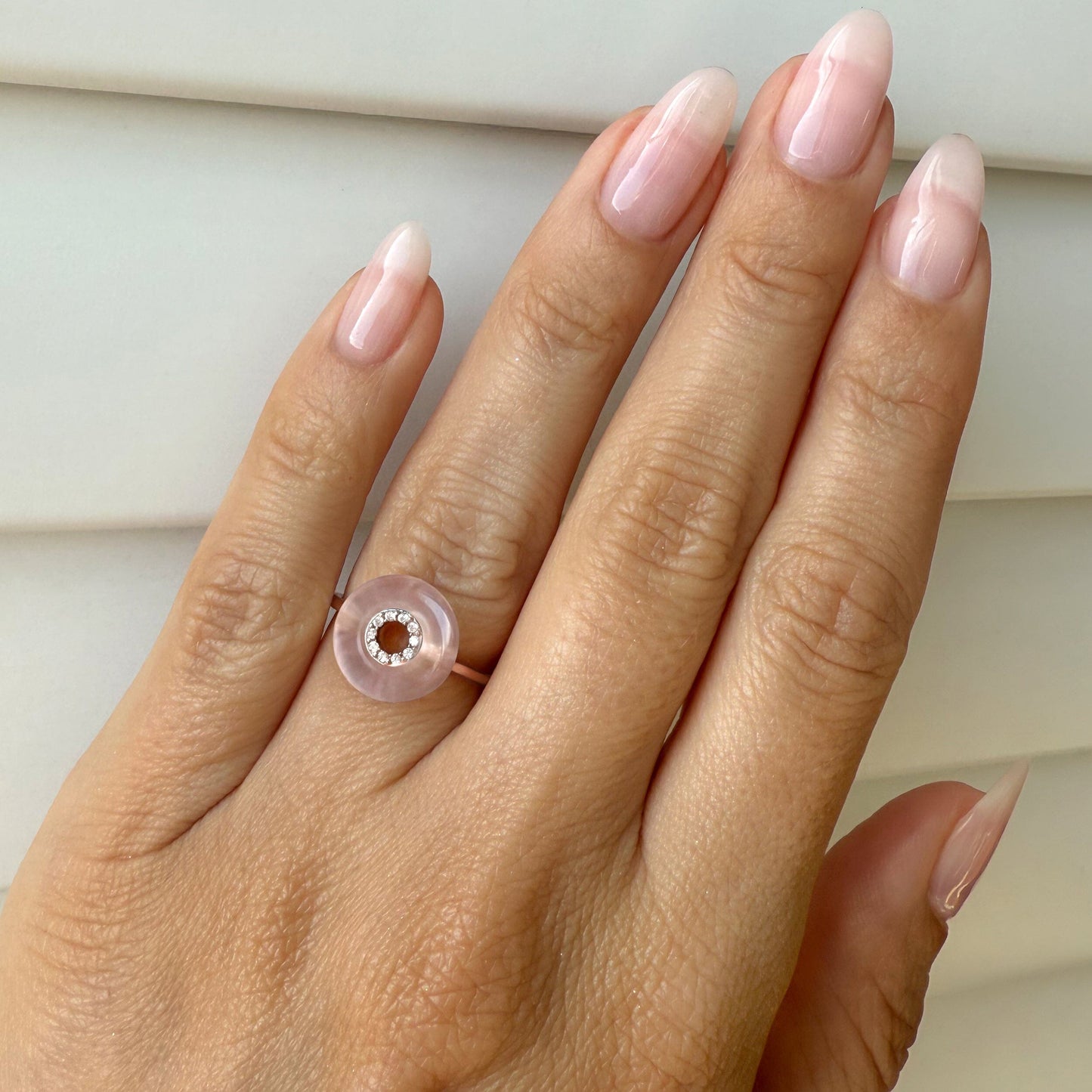 Rose Quartz Fidget Ring - Liora, rose gold on hand