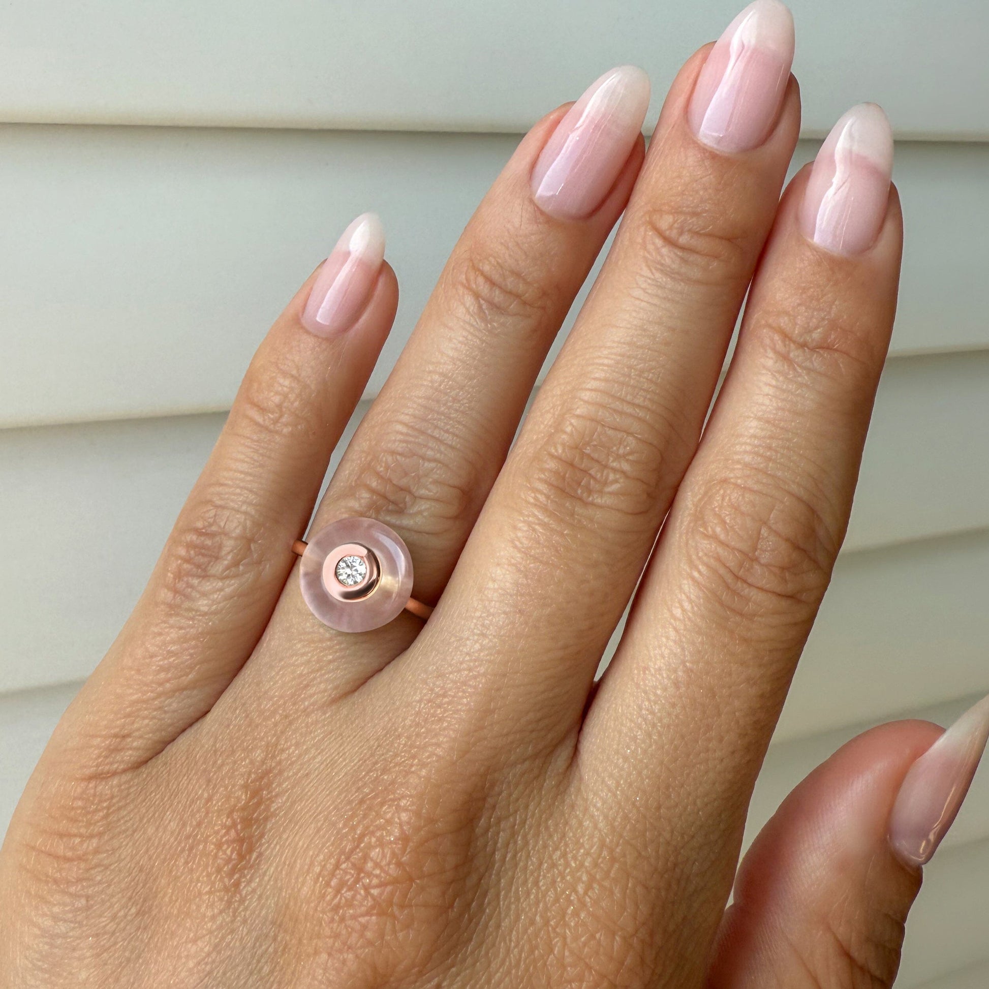 Rose Quartz Fidget Ring - Ora, rose gold on hand