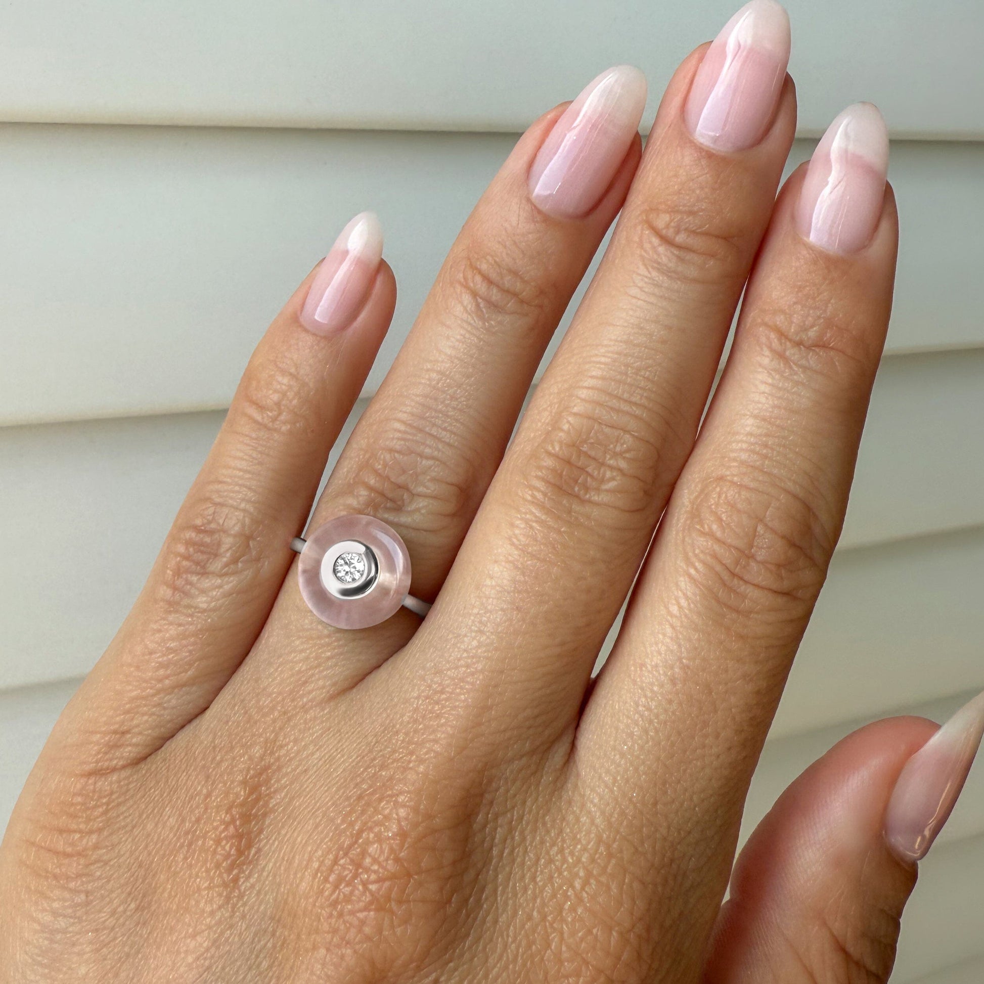 Rose Quartz Fidget Ring - Ora, silver on hand