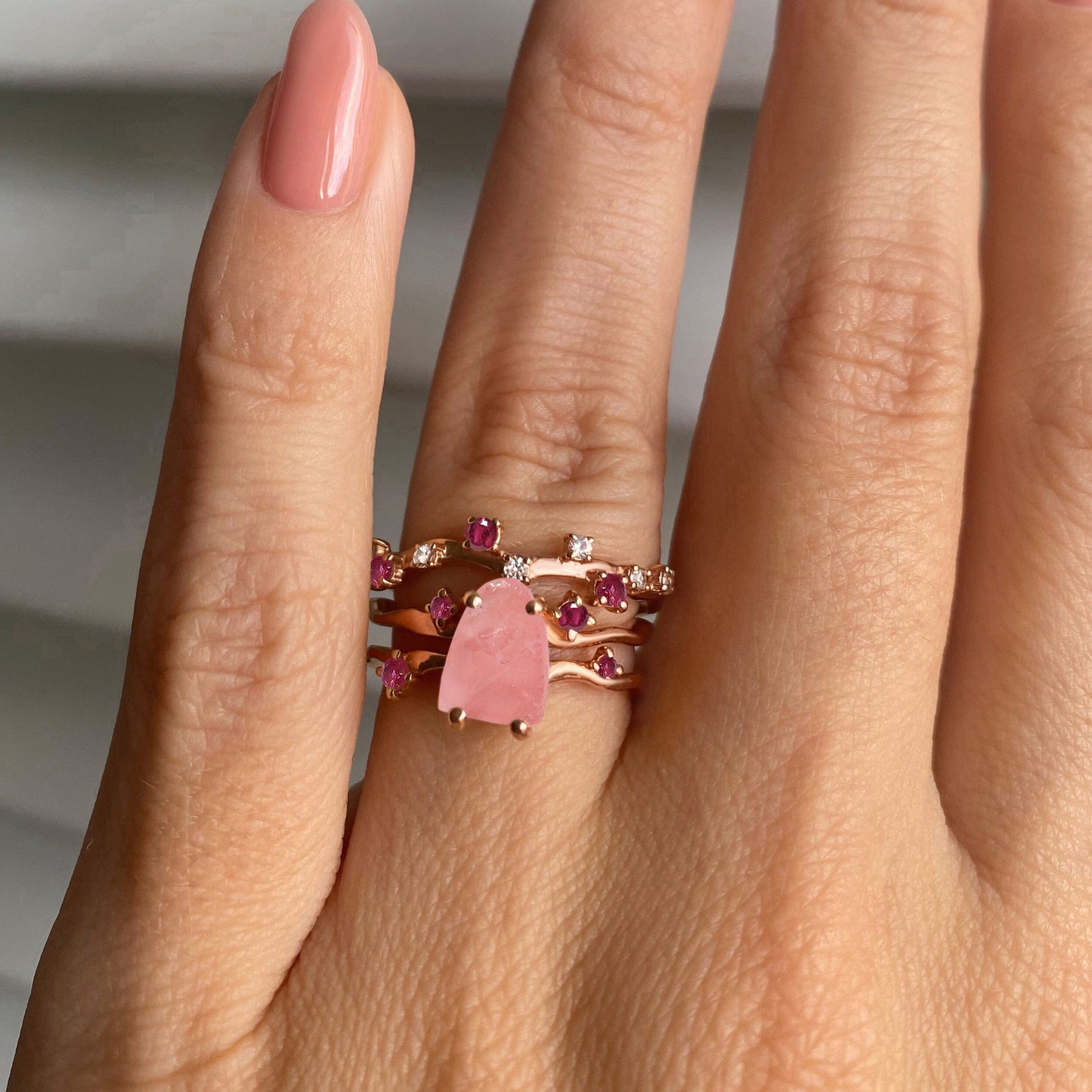 Rose Quartz Flow & Ruby Stardust Rings, rose gold on hand