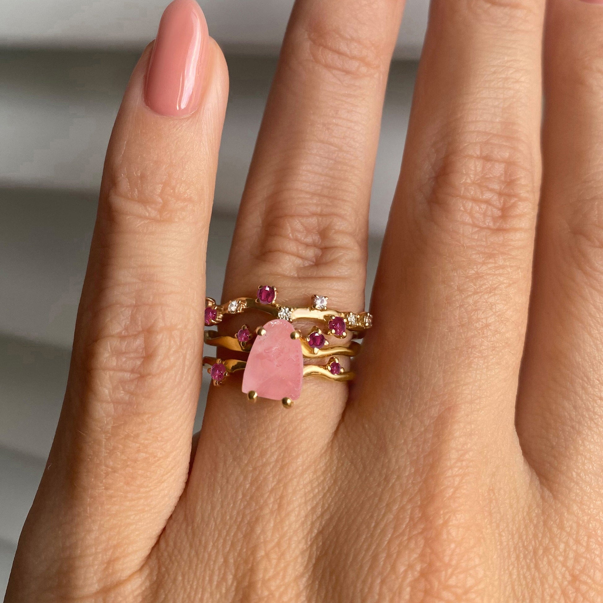 Rose Quartz Flow & Ruby Stardust Rings, yellow gold on hand