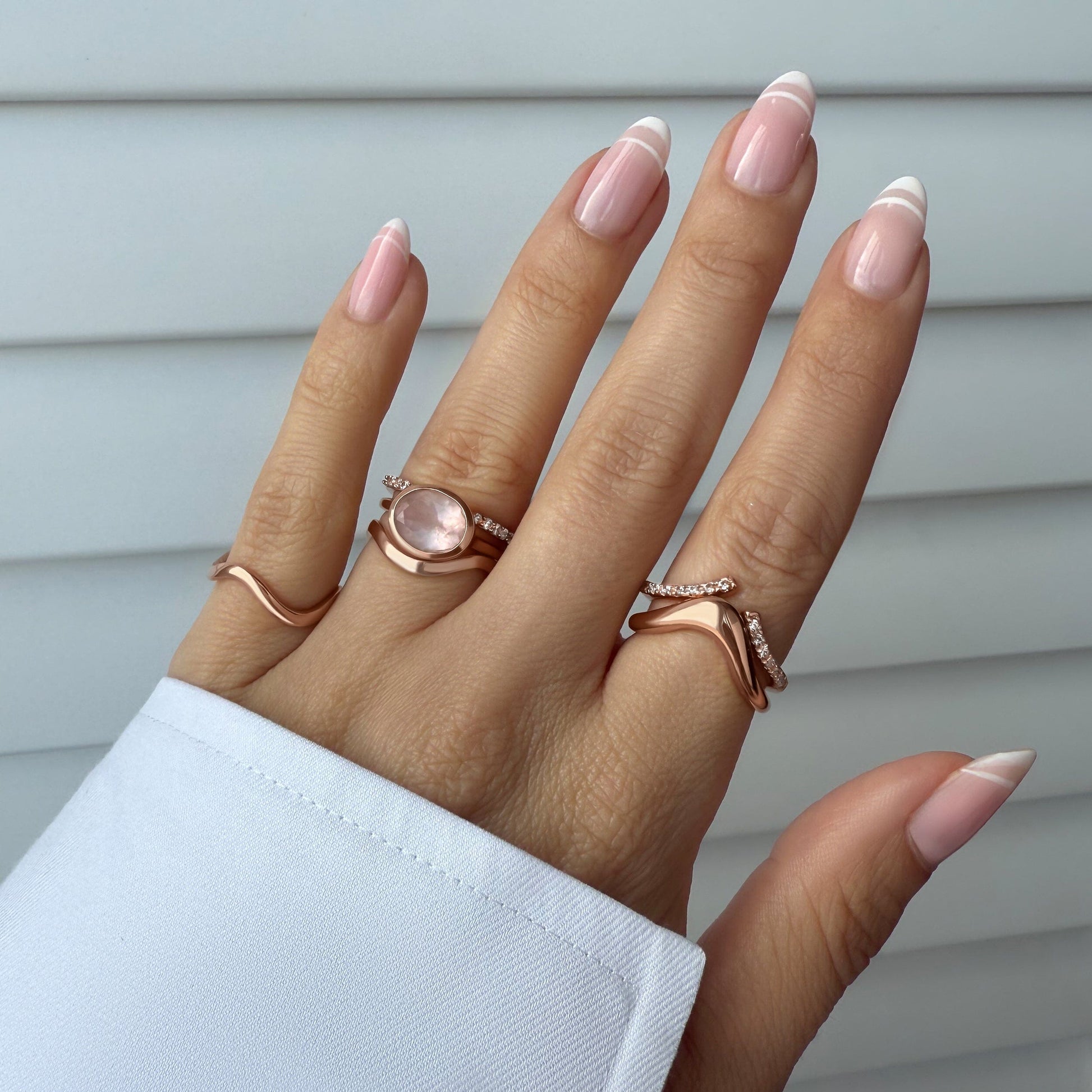 Rose Quartz Skin Touch Ring & Waves Band - rose gold on hand detail