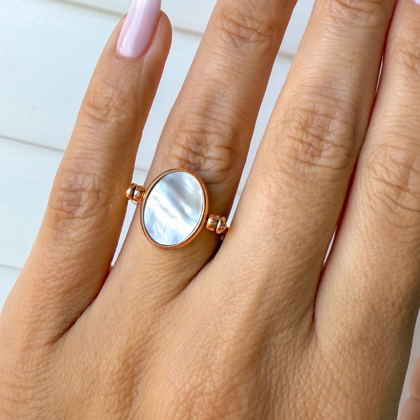 Black Onyx Mother of Pearl Fidget Ring - rose gold on hand
