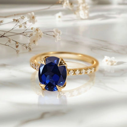Blue Sapphire Ring Harlow - yellow gold on marble