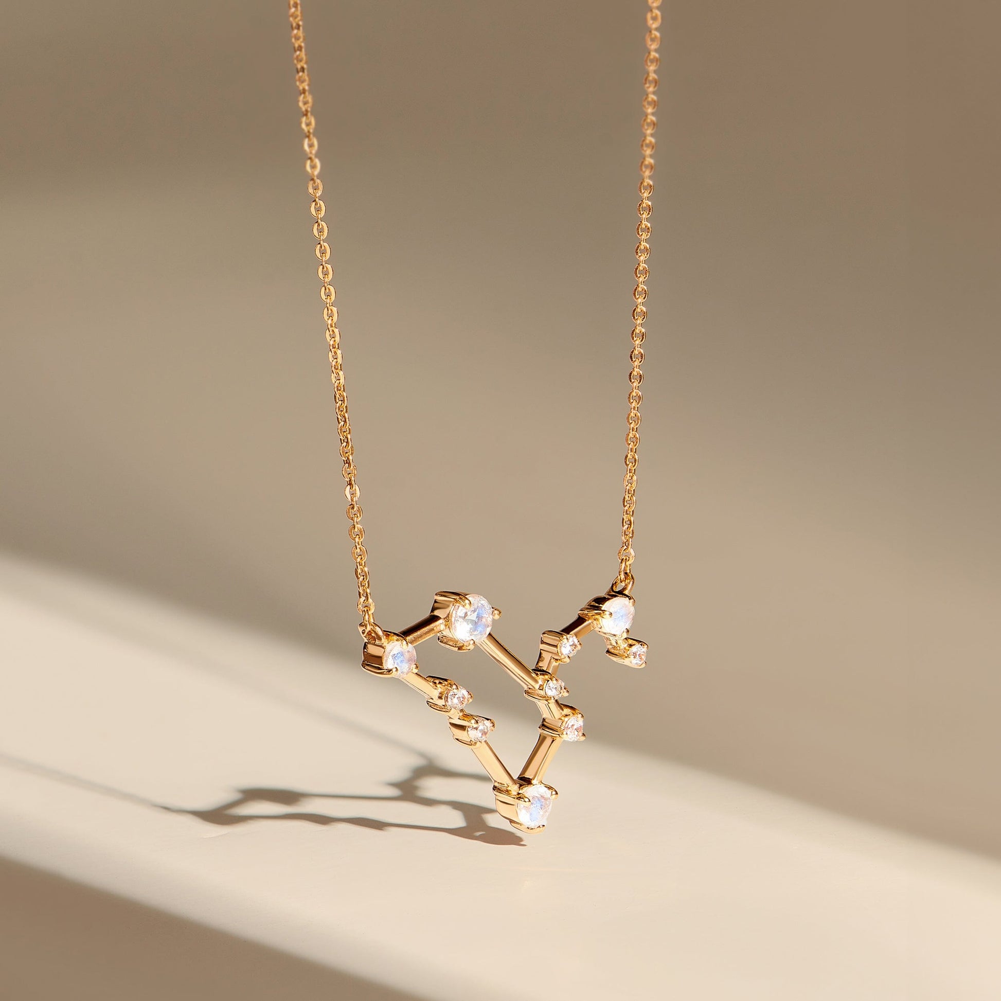 Fine Moonstone Lab Diamond Necklace - Leo Zodiac Constellation - yellow gold flatlay