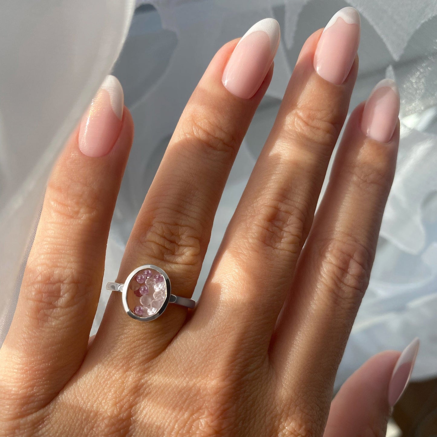 Rose Quartz Rhodolite Ring - Halo of Calm - silver on hand