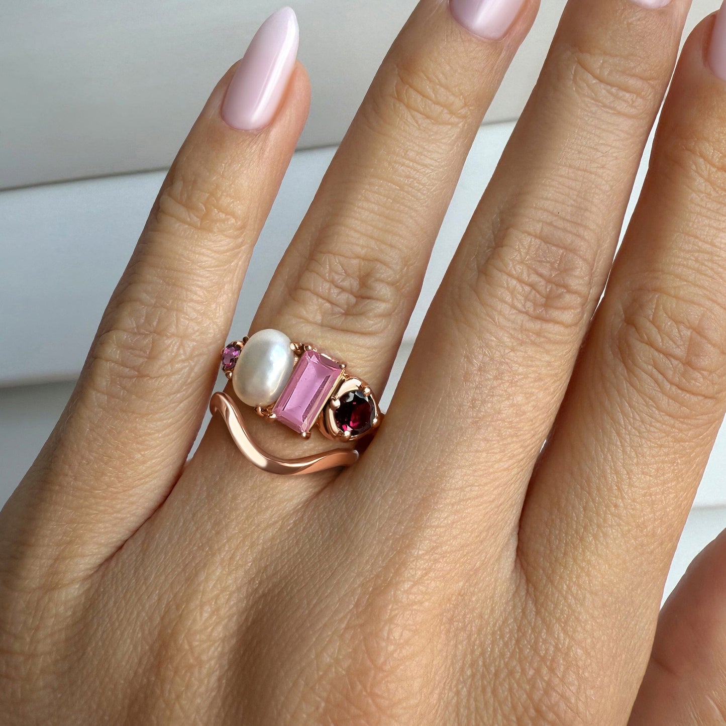 Treasure Waves ring stack rose gold on hand