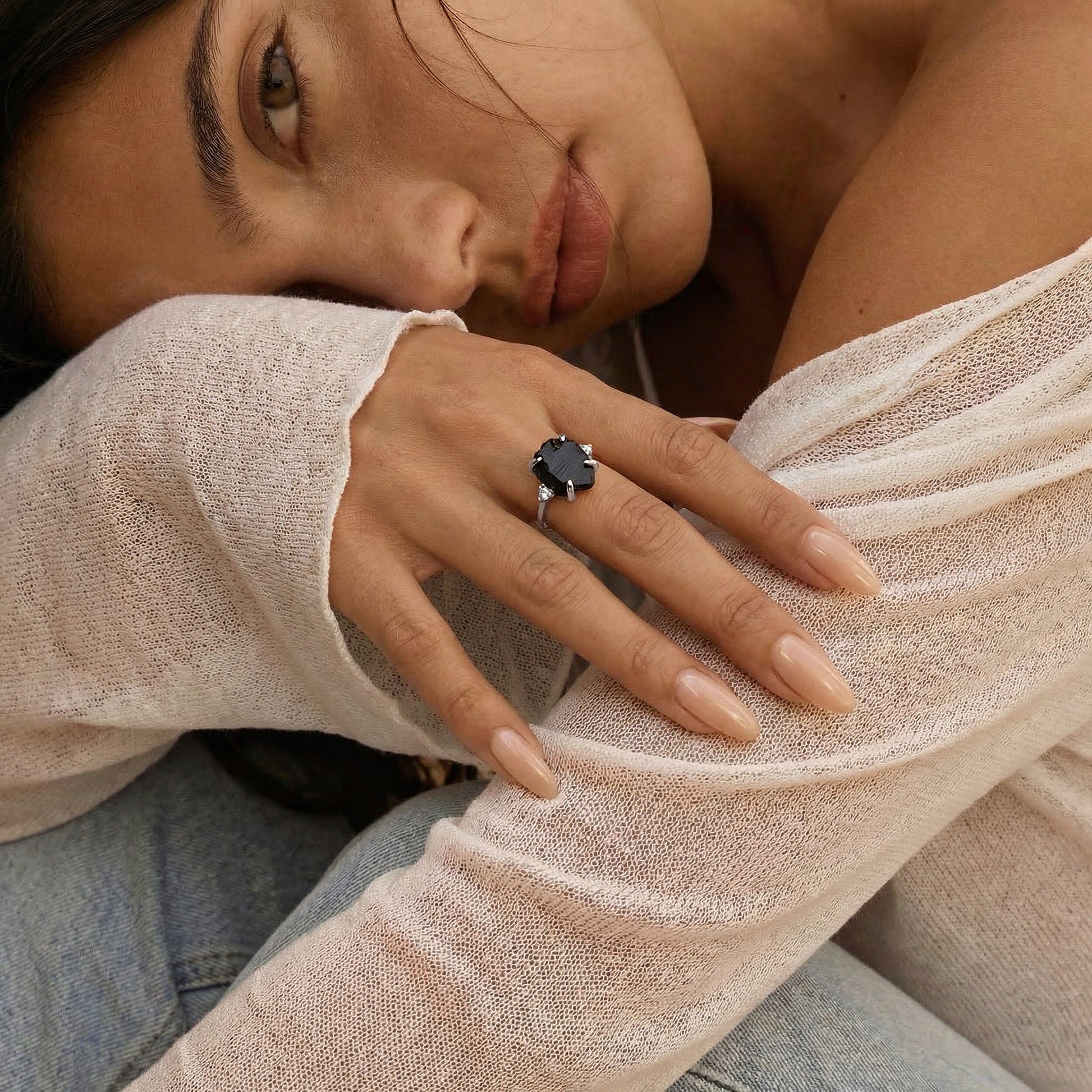 Raw Allure ring white gold on hand with face