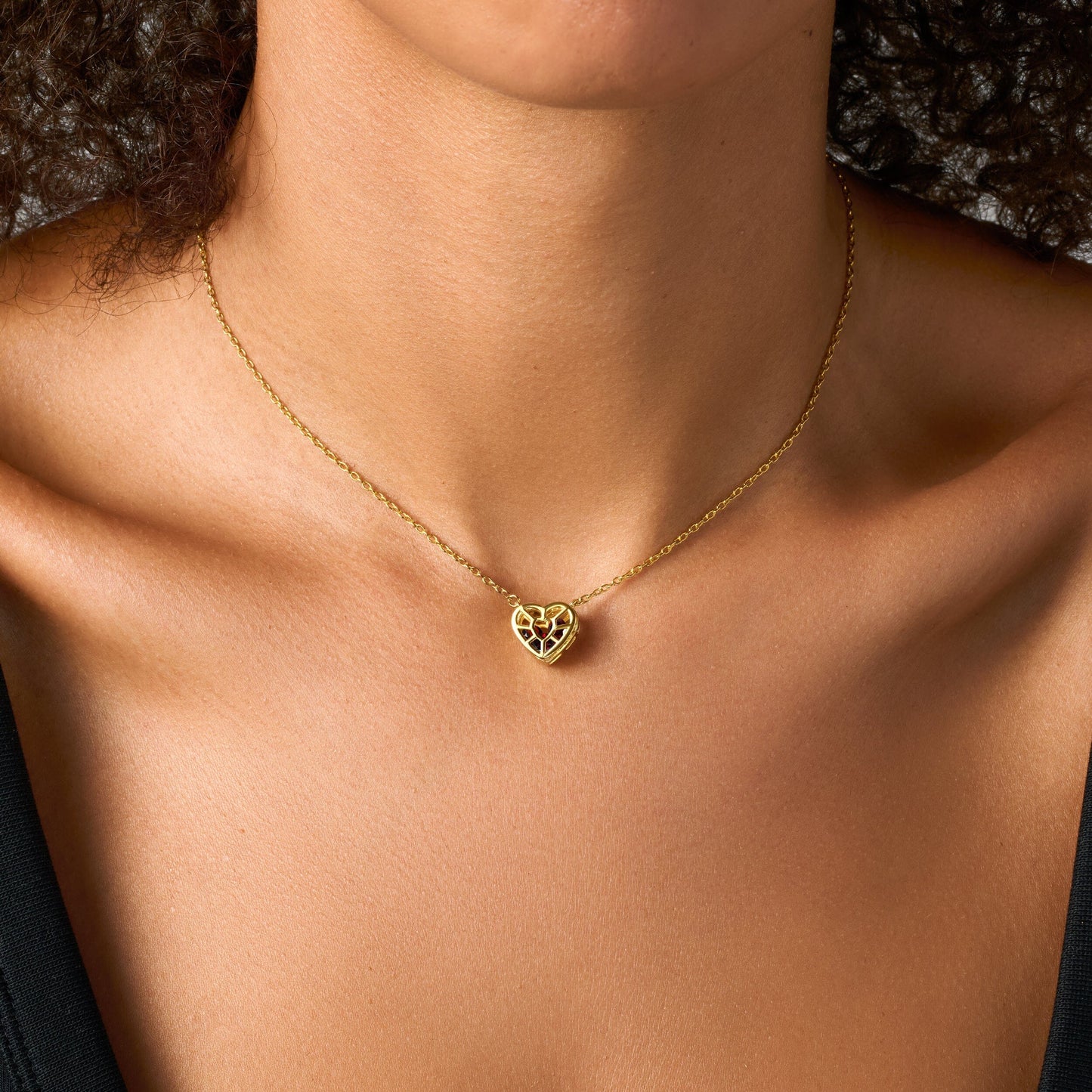 Heart in Motion necklace yellow gold on neck