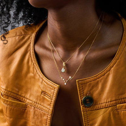 Pisces Zodiac & March Birthstone Necklaces - yellow gold worn