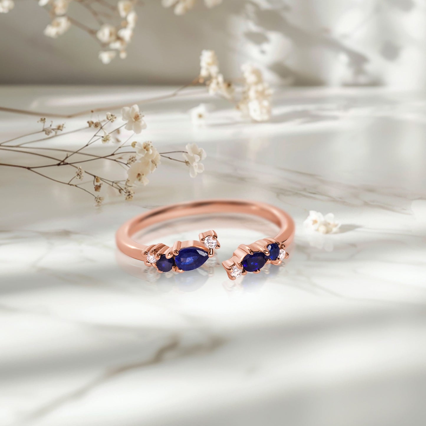 Adjustable Blue Sapphire Ring Flourish - rose gold on marble