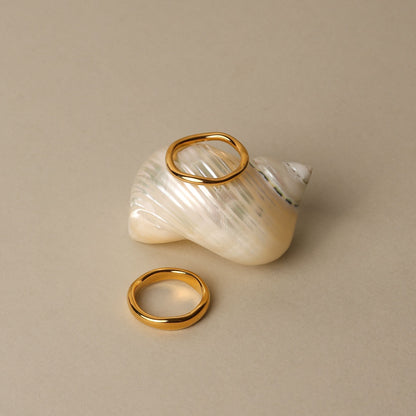 Gemini gold ring set on seashell